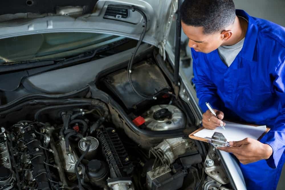 A licensed CarHero technician completing a pre-RTA inspection